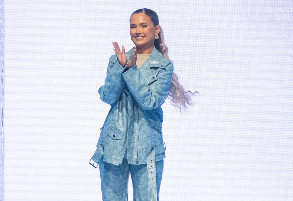 Molly-Mae Hague clapping at a fashion show